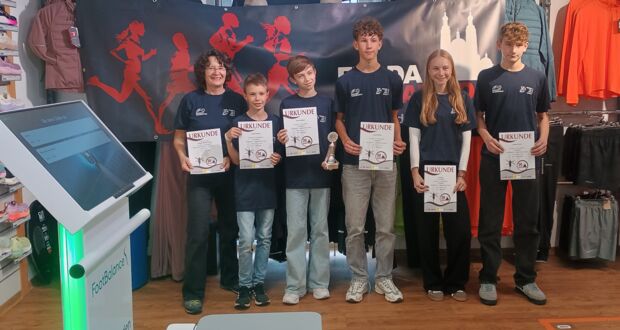 Ehrung der Minimarathonläuferin und Minimarathonläufer im Sporthaus Marquardt